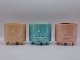 Plant pots with faces and feet artificial flora